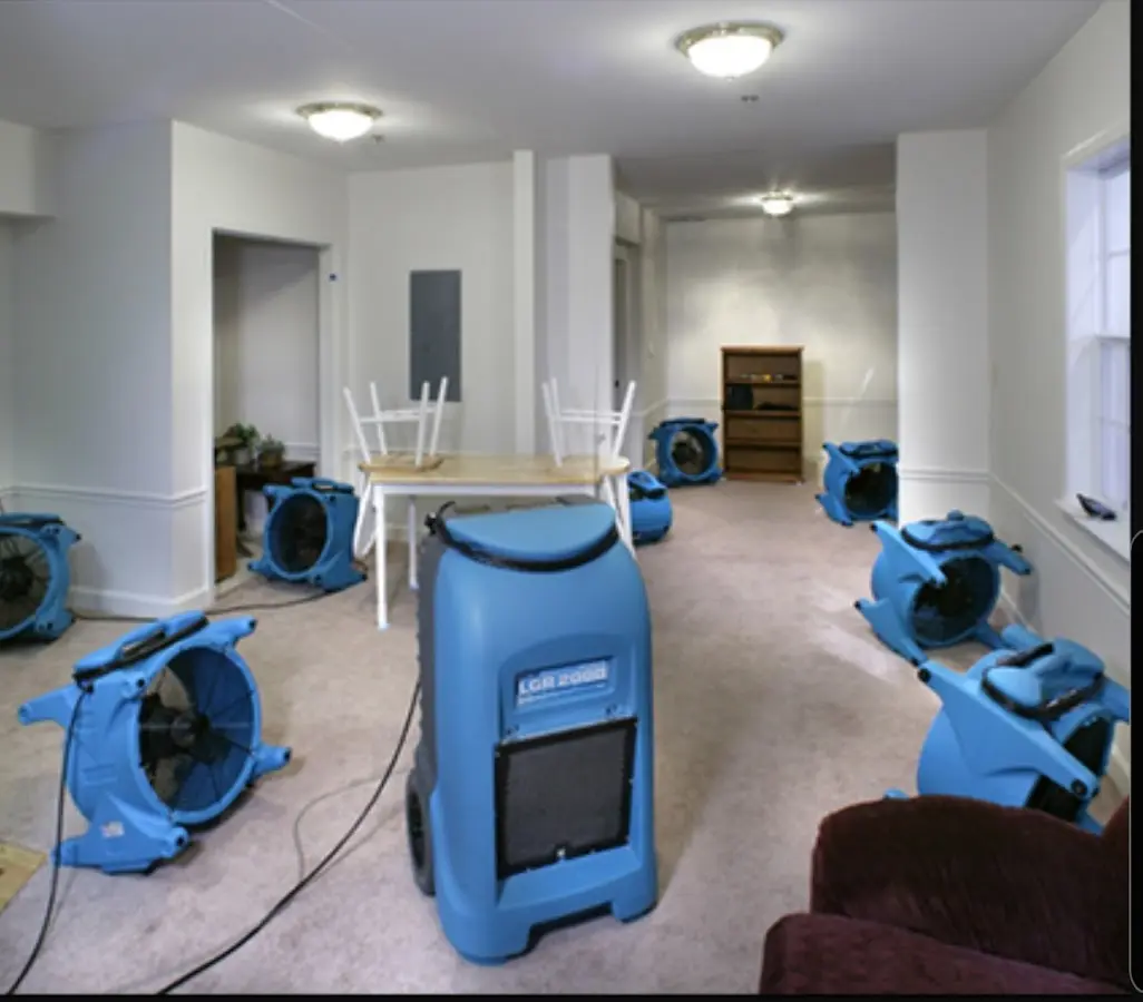 Air movers and dehumidifier setup for Water Damage Restoration in Ulysses